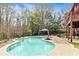 Inviting backyard pool featuring stone trim, a fire pit, and an outdoor gazebo at 500 Poplar Creek Xing, Canton, GA 30114