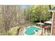View of pool and gazebo, set amid a backdrop of mature trees, creating a tranquil retreat for outdoor enjoyment at 500 Poplar Creek Xing, Canton, GA 30114