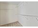 Spacious walk-in closet featuring white walls, carpeted floor and ample shelving units for convenient storage at 500 Poplar Creek Xing, Canton, GA 30114