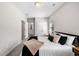 Bright bedroom with plush bedding, closet, and an en-suite bathroom at 234 Retreat Ln, Canton, GA 30114