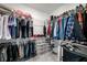 Spacious walk-in closet with organized shelving and hanging space for clothing and storage bins at 234 Retreat Ln, Canton, GA 30114