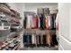 Walk-in closet with wire shelving and rods for hanging and storing clothes and accessories at 234 Retreat Ln, Canton, GA 30114