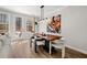 Well-lit dining area with modern lighting, wood table, and access to outdoor deck at 234 Retreat Ln, Canton, GA 30114