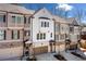 Attractive townhome row displays varied exterior colors, brick foundations, garages, and landscaped front yards at 234 Retreat Ln, Canton, GA 30114