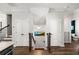 Hallway with staircase, doors, and a view of a bathroom at 234 Retreat Ln, Canton, GA 30114