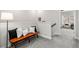 Open hallway area with a bench, a floor lamp, and a view of a seating nook at 234 Retreat Ln, Canton, GA 30114