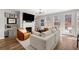 Cozy living room features a fireplace, large windows, and a plush sofa perfect for relaxing at 234 Retreat Ln, Canton, GA 30114