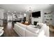 Open concept living room with fireplace, built-in shelving and views of the kitchen at 234 Retreat Ln, Canton, GA 30114