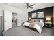 Serene main bedroom with a dark accent wall, plush bedding and elegant decor at 234 Retreat Ln, Canton, GA 30114