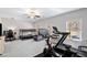 Bright recreation room features neutral carpeting, ceiling fan, and lots of room for entertaining or play at 234 Retreat Ln, Canton, GA 30114