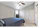 Bedroom featuring a large window, vaulted ceiling, and closet at 241 Quail Run, Roswell, GA 30076