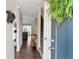 Welcoming foyer features hardwood floors, stairs to the second floor, and views of the living room at 241 Quail Run, Roswell, GA 30076