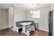 Bright kitchen with built-in seating, white cabinets, and modern appliances at 241 Quail Run, Roswell, GA 30076