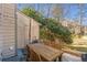 Private patio with outdoor seating for four, convenient for dining al fresco at 241 Quail Run, Roswell, GA 30076