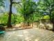 Wood deck with green yard and mature trees in the backyard at 646 Catherine Sw St, Atlanta, GA 30310