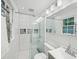Bathroom featuring bright white subway tile, and glass-enclosed shower at 646 Catherine Sw St, Atlanta, GA 30310