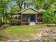 Charming bungalow with a well-manicured lawn, stone wall and inviting greenery at 646 Catherine Sw St, Atlanta, GA 30310