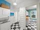 Checkerboard floor connects the laundry area to a bright, adjacent space at 646 Catherine Sw St, Atlanta, GA 30310