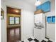 Efficient laundry area with stacked washer and dryer on a checkerboard floor at 646 Catherine Sw St, Atlanta, GA 30310