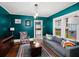 Stylish living room with bold wall color, hardwood floors, and comfortable seating at 646 Catherine Sw St, Atlanta, GA 30310