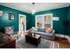 Cozy living room featuring hardwood floors, a plush couch, and stylish decor at 646 Catherine Sw St, Atlanta, GA 30310