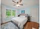 Comfortable main bedroom with bright windows and hardwood floors at 646 Catherine Sw St, Atlanta, GA 30310