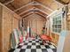 Interior of a storage shed with checkered flooring and exposed wood frame at 646 Catherine Sw St, Atlanta, GA 30310