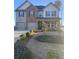 Charming two-story home with front yard, landscaped pathway, and a two-car garage at 802 Major Oak Ct, Villa Rica, GA 30180