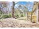 Home with wooden deck perfect for outdoor gatherings and enjoying the serene surroundings at 1295 Maple St Se, Conyers, GA 30013