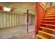 A basement with exposed framing and a staircase at 1295 Maple St Se, Conyers, GA 30013