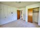 Spacious bedroom featuring a closet, carpeted floors, and neutral-colored walls at 1295 Maple St Se, Conyers, GA 30013