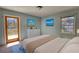 Comfortable bedroom with a door to the deck, a double window, and stylish decor at 1295 Maple St Se, Conyers, GA 30013