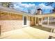 Spacious wooden deck attached to a brick home, ideal for outdoor dining and relaxation at 1295 Maple St Se, Conyers, GA 30013