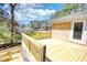 Newly constructed wooden deck perfect for outdoor enjoyment and entertaining overlooking the backyard at 1295 Maple St Se, Conyers, GA 30013