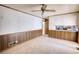 Comfortable living room with wood paneling and carpeting at 1295 Maple St Se, Conyers, GA 30013