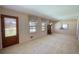 Spacious living room with a large front window and ample space for furniture at 1295 Maple St Se, Conyers, GA 30013