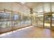 Bright sunroom with skylights, fan, and many windows overlooking the backyard and a deck at 1295 Maple St Se, Conyers, GA 30013
