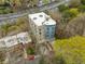 Aerial view of modern apartment building surrounded by lush trees and highway at 140 Alden Nw Ave # 201, Atlanta, GA 30309