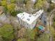 An aerial view shows the condo building with a community pool and surrounding green space at 140 Alden Nw Ave # 201, Atlanta, GA 30309