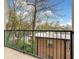 Balcony view overlooking trees and rooftops with city skyline in the distance at 140 Alden Nw Ave # 201, Atlanta, GA 30309