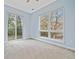 Sunlit bedroom with a double window that provides views of trees and natural light at 140 Alden Nw Ave # 201, Atlanta, GA 30309