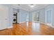 The bedroom has hardwood floors, a sliding glass door, and a stacked washer and dryer at 140 Alden Nw Ave # 201, Atlanta, GA 30309
