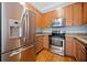 Kitchen featuring stainless steel appliances including a refrigerator, oven, and microwave and granite countertops at 140 Alden Nw Ave # 201, Atlanta, GA 30309