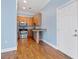 Cozy kitchen featuring wood cabinets, stainless steel appliances, and granite countertops at 140 Alden Nw Ave # 201, Atlanta, GA 30309