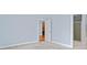 Carpeted primary bedroom features a doorway leading to the kitchen and an ensuite bathroom at 140 Alden Nw Ave # 201, Atlanta, GA 30309