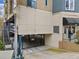 View of the building's parking garage entrance and adjacent staircase at 140 Alden Nw Ave # 201, Atlanta, GA 30309