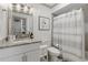 Bathroom with modern vanity, neutral paint, hardwood floors, and shower and tub combination at 178 Barone Nw Pl, Atlanta, GA 30327