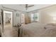 Bright bedroom leads to bathroom; features wood-look flooring and a ceiling fan at 178 Barone Nw Pl, Atlanta, GA 30327