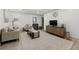 Spacious living room featuring hardwood floors, neutral tones, modern decor, and television on a unique media console at 178 Barone Nw Pl, Atlanta, GA 30327