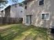 Backyard view showcasing the home's siding, a patio door, and a privacy fence at 3518 Sable Glen, South Fulton, GA 30349